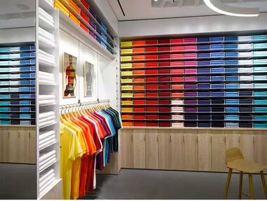 Lacoste boutique wall of colourful polo shirts
